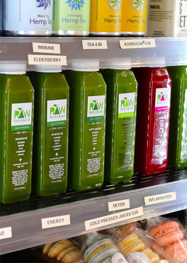 Cold-pressed juice & smoothie franchise image of juices in counter